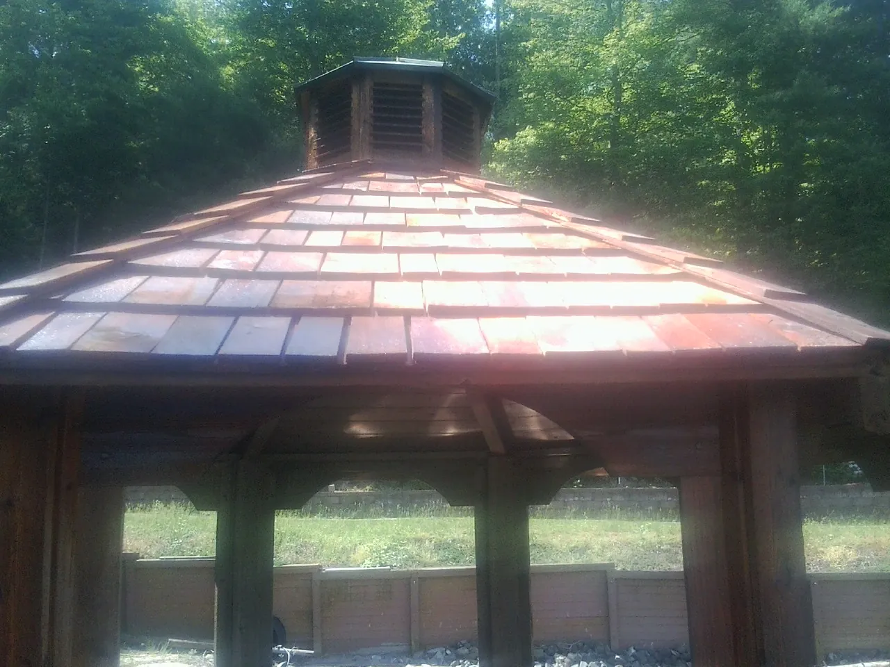 New cedar shake roof and cupola on a lakeside gazebo in Arkport